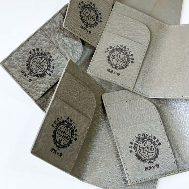 Customized promotional leather accessory kit with subtle embossed brand identity