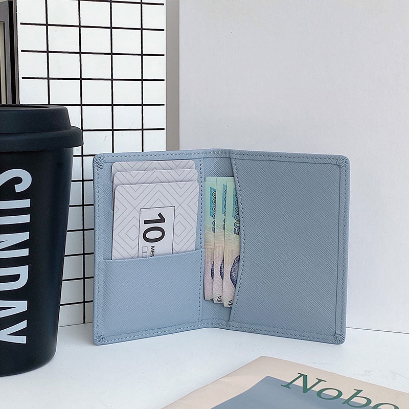 Ultra-slim handcrafted card sleeve holding essential credit cards