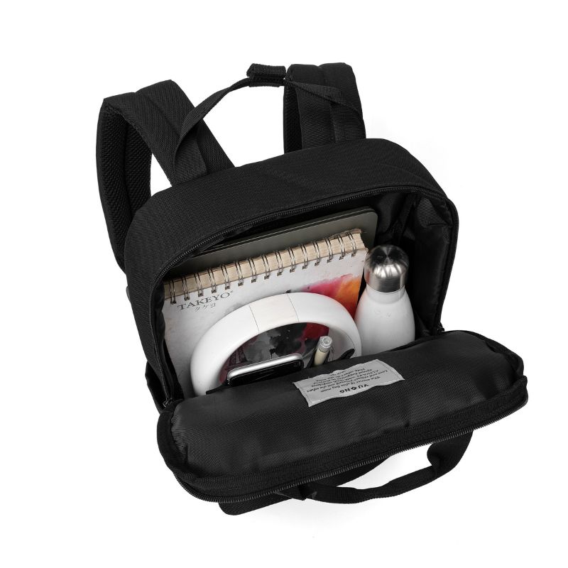 Durable black multi-compartment artisan travel backpack with reinforced stitching